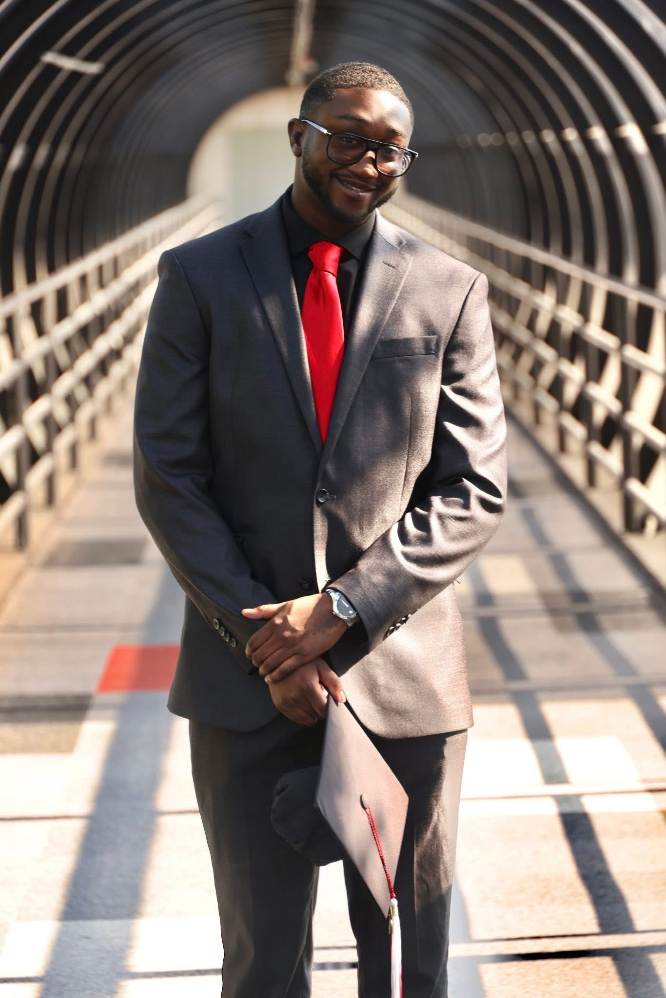 Graduation portrait on a bridge by SoFreeDidIt