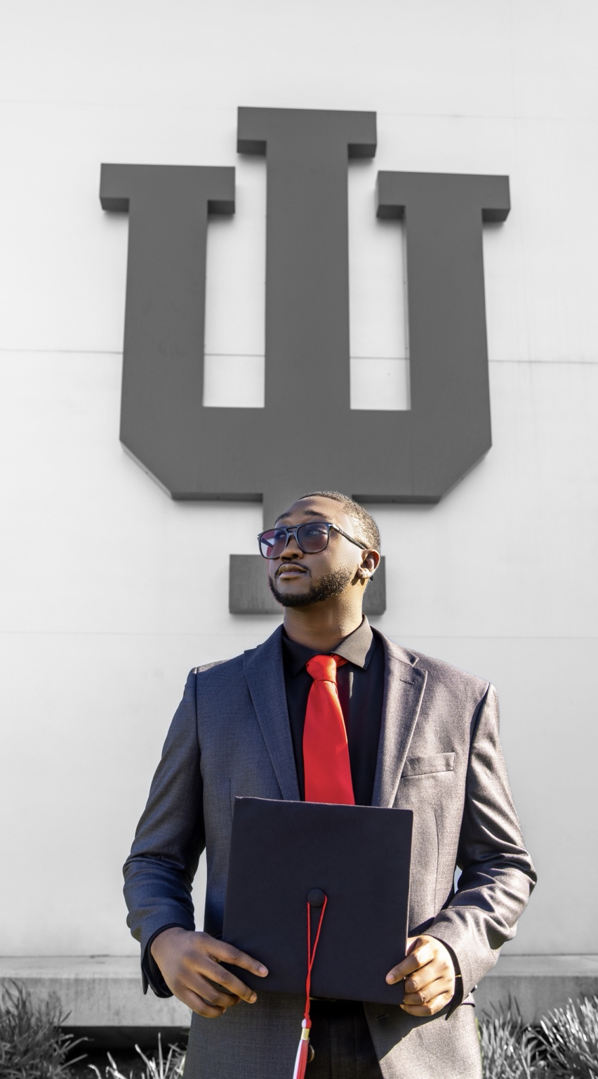 Graduation portrait in front of Indiana University sign by SoFreeDidIt
