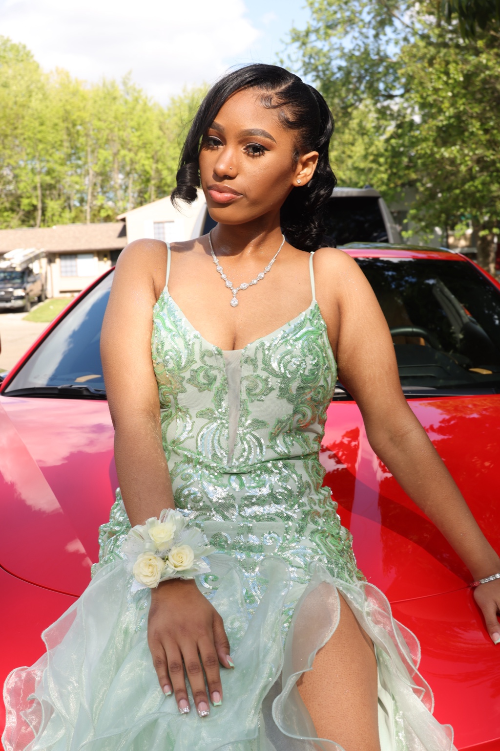 Prom portrait in front of a red car by SoFreeDidIt